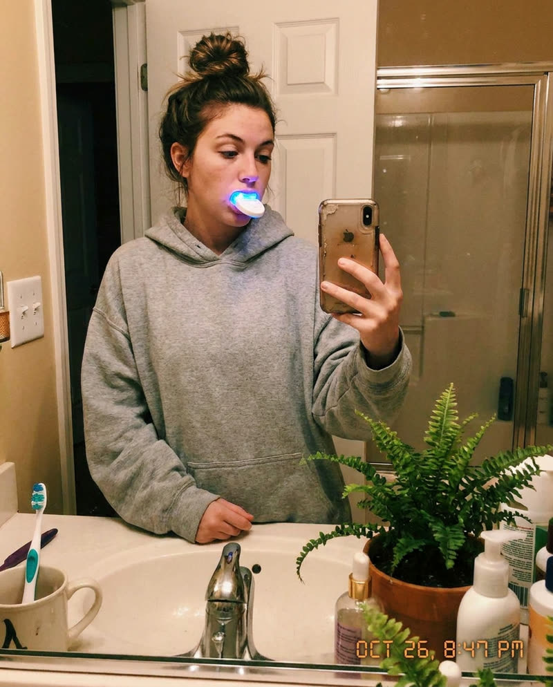 Customer using the LED whitening light