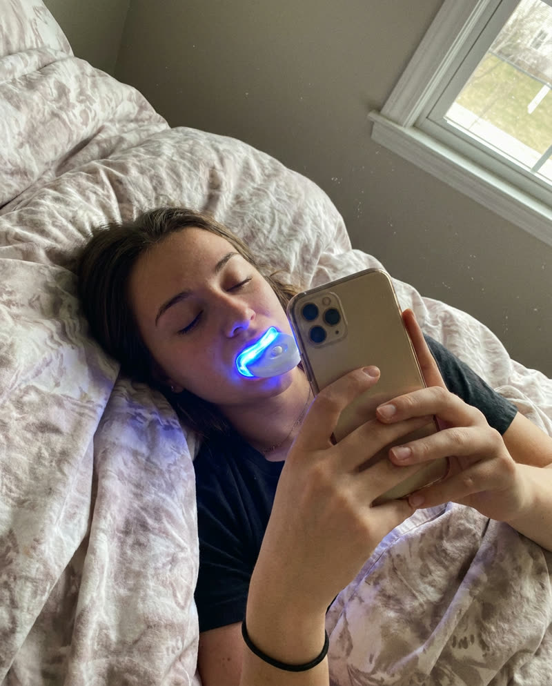 Customer relaxing during a whitening session